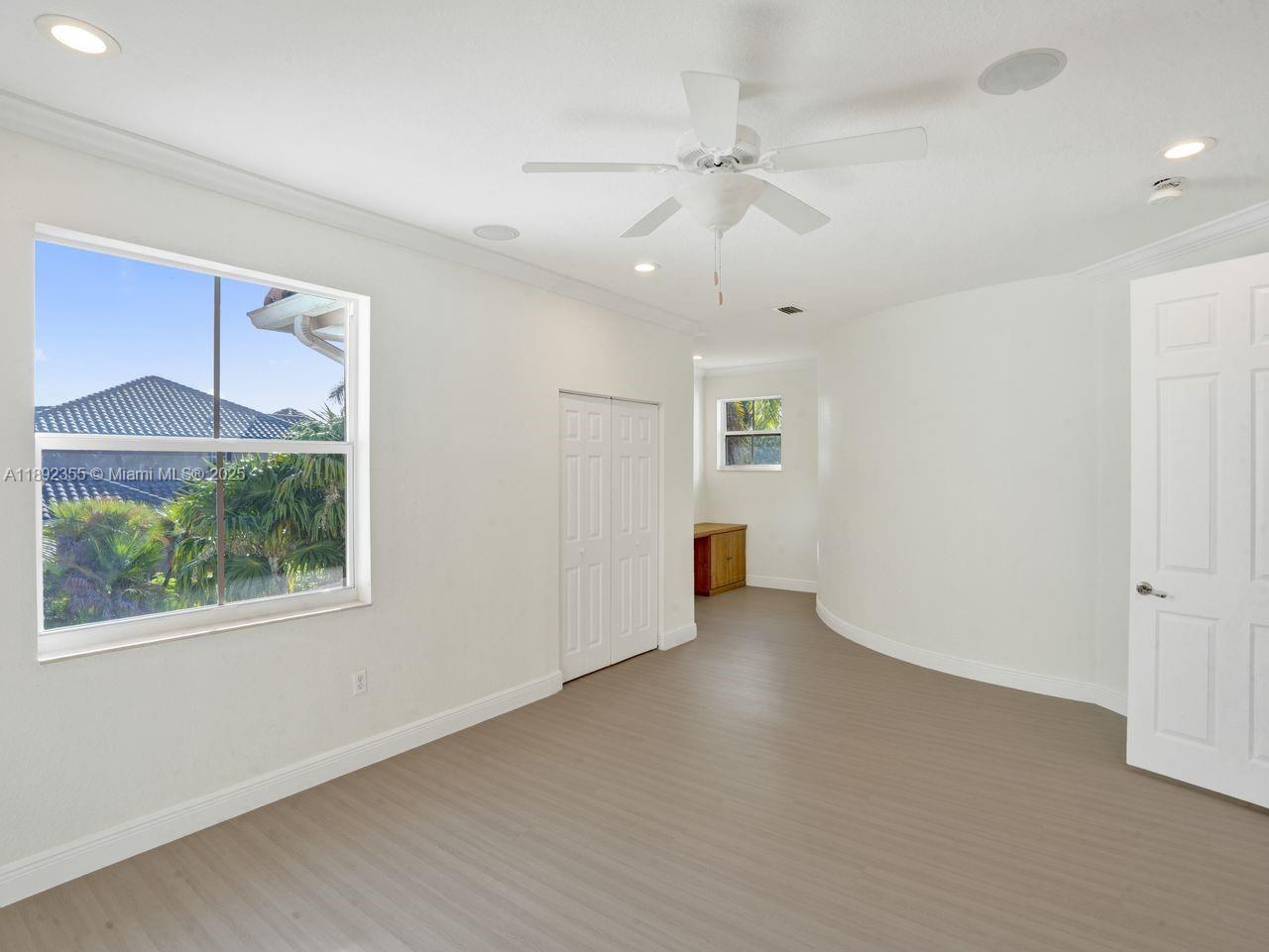14403 Jockey Circle Davie, FL 33330 - Photo 28 of 53 an empty room with fan and windows