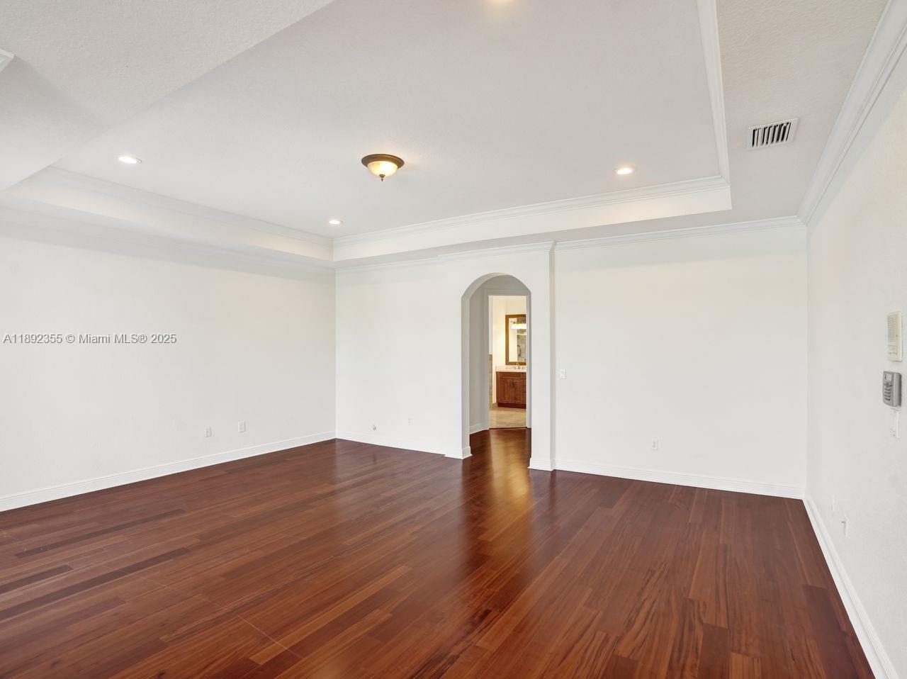 14403 Jockey Circle Davie, FL 33330 - Photo 29 of 53 a view of empty room with wooden floor