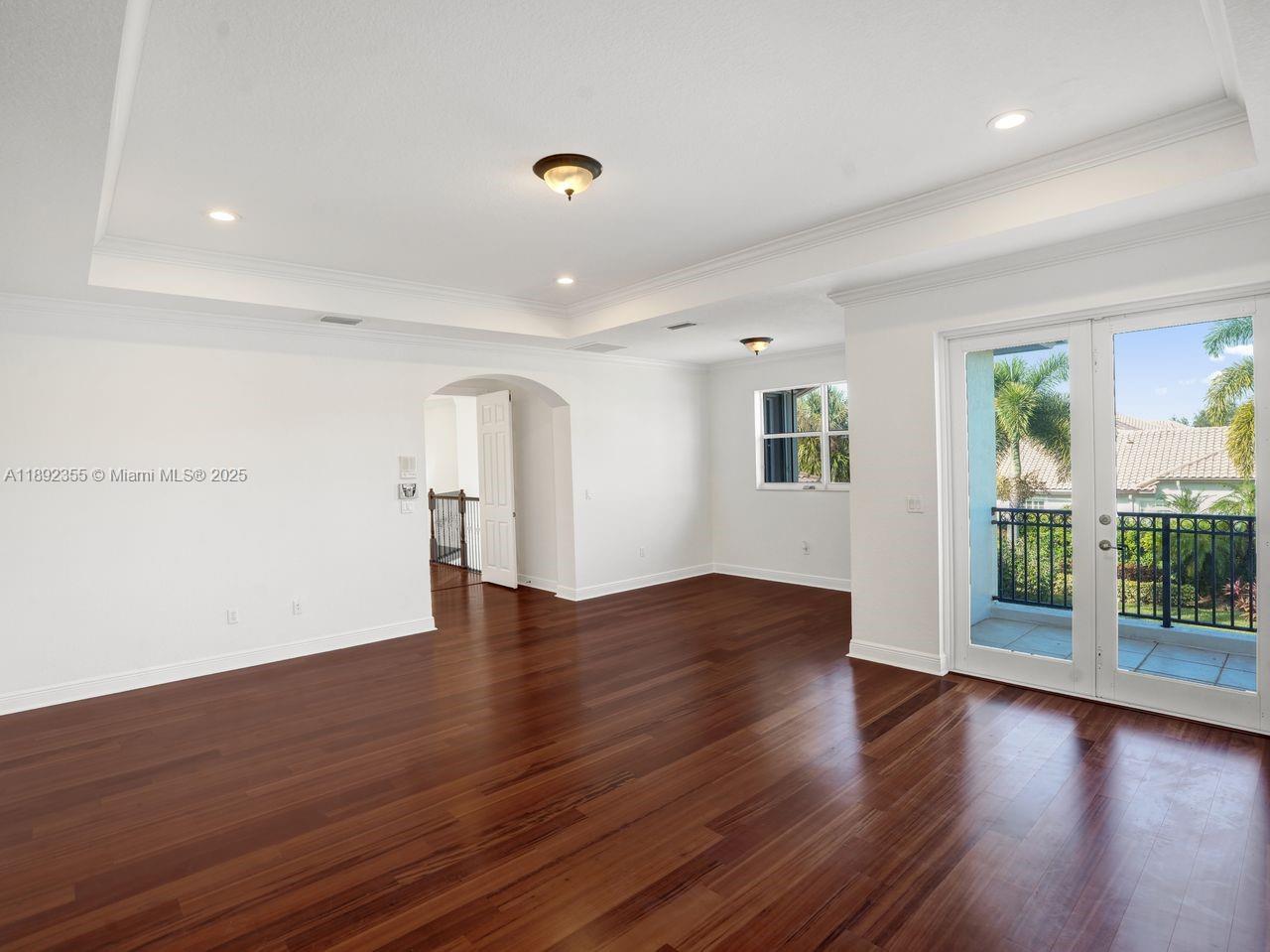 14403 Jockey Circle Davie, FL 33330 - Photo 30 of 53 a view of empty room with wooden floor and fan