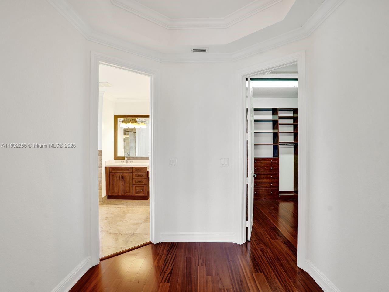 14403 Jockey Circle Davie, FL 33330 - Photo 32 of 53 an empty room with wooden floor closet and windows