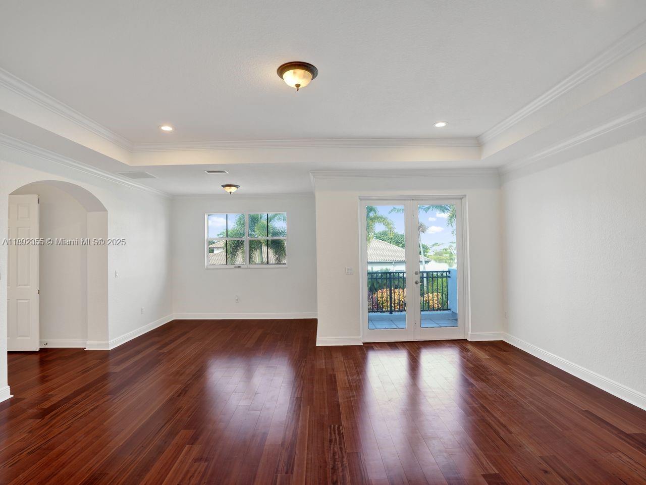 14403 Jockey Circle Davie, FL 33330 - Photo 35 of 53 a view of an empty room with wooden floor and a window