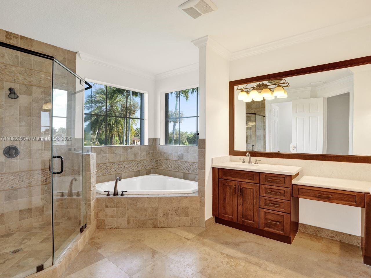 14403 Jockey Circle Davie, FL 33330 - Photo 36 of 53 a spacious bathroom with a tub sink and mirror