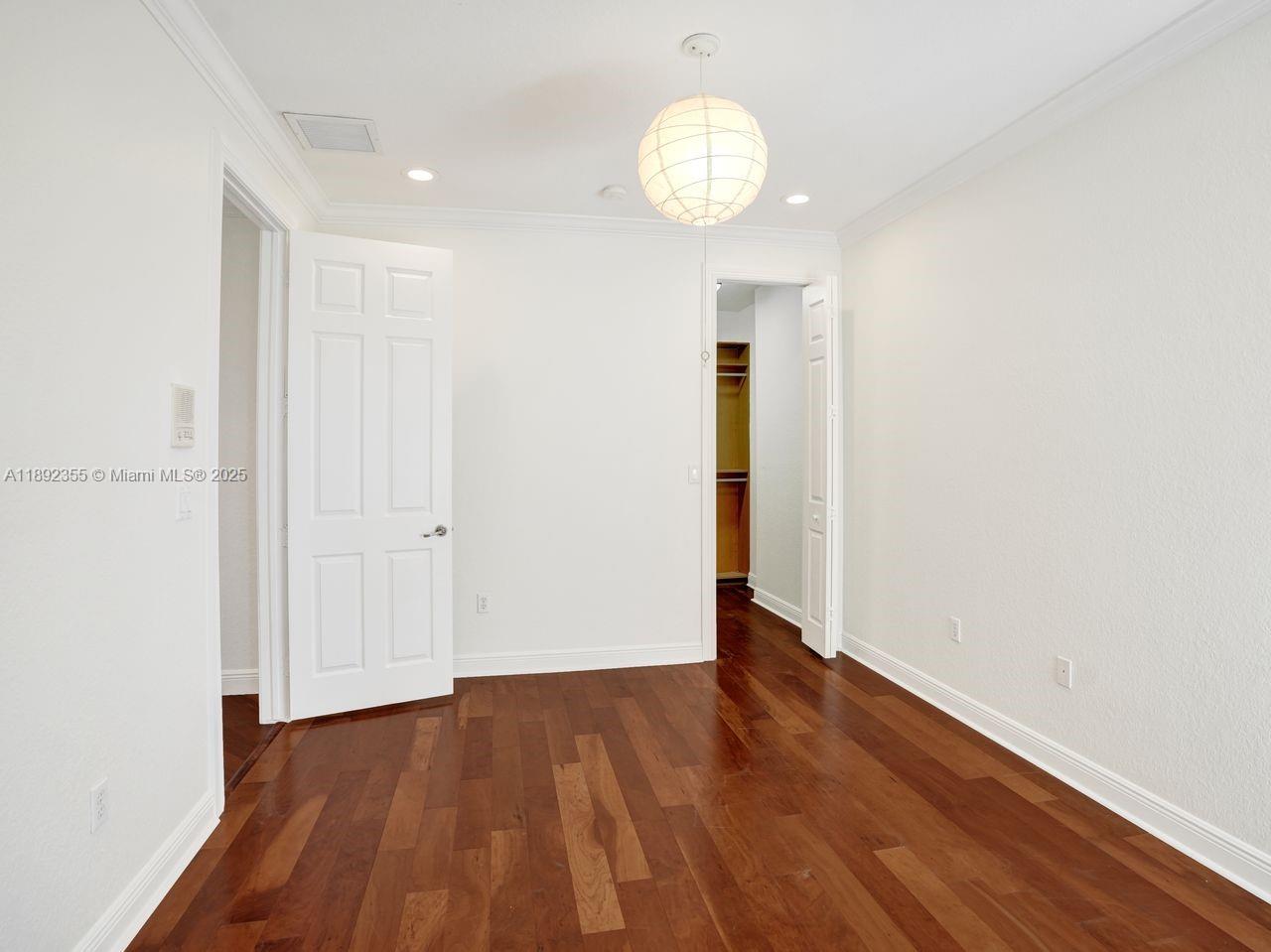 14403 Jockey Circle Davie, FL 33330 - Photo 42 of 53 a view of an empty room with wooden floor and a window