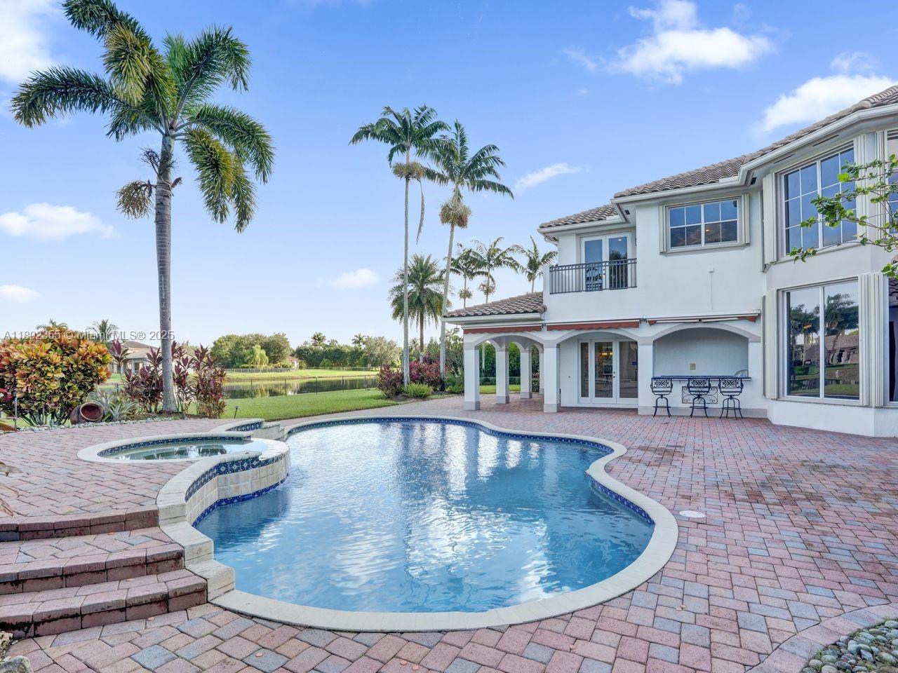 14403 Jockey Circle Davie, FL 33330 - Photo 46 of 53 a view of a house with swimming pool