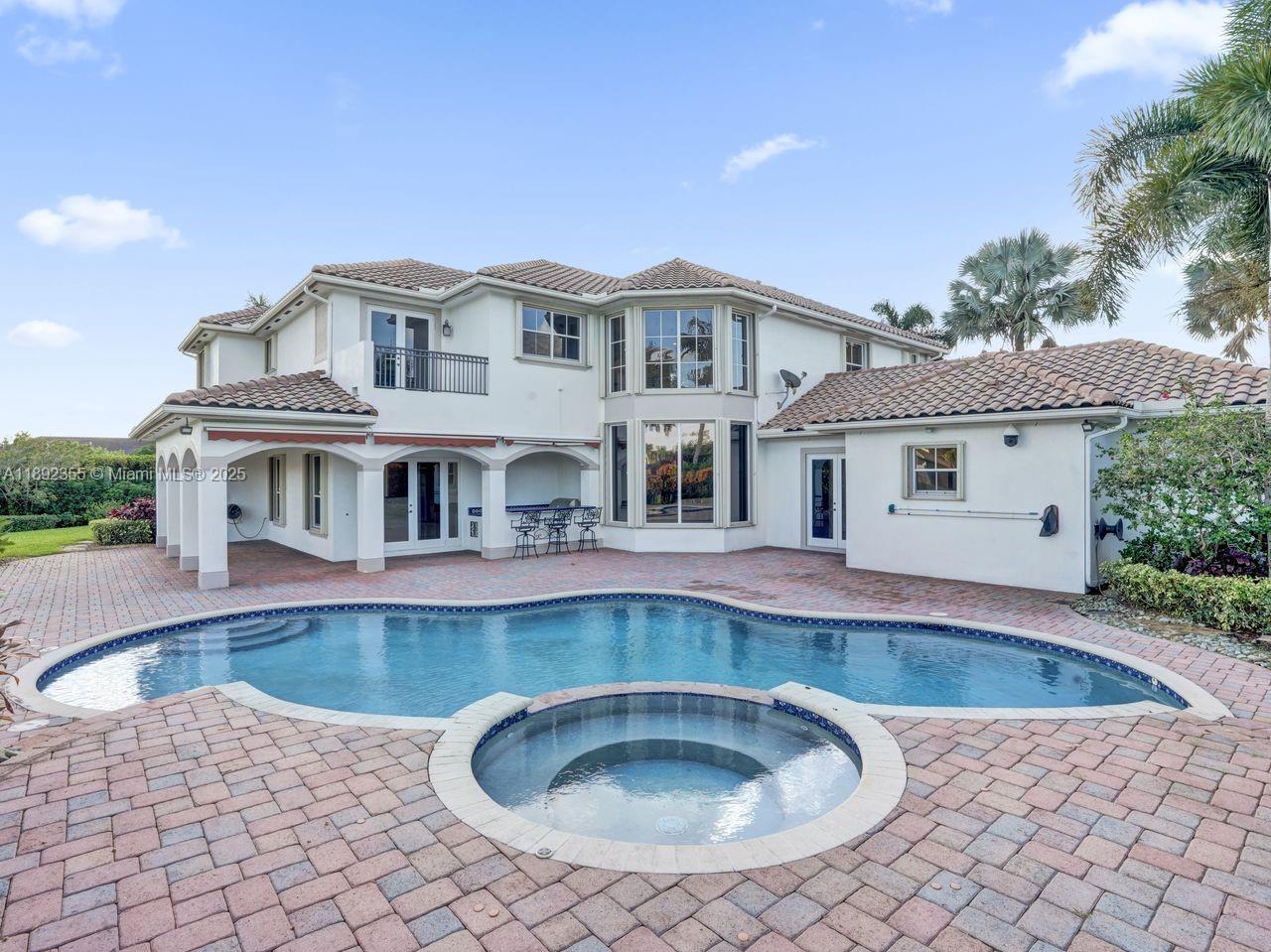 14403 Jockey Circle Davie, FL 33330 - Photo 47 of 53 a front view of a house with swimming pool