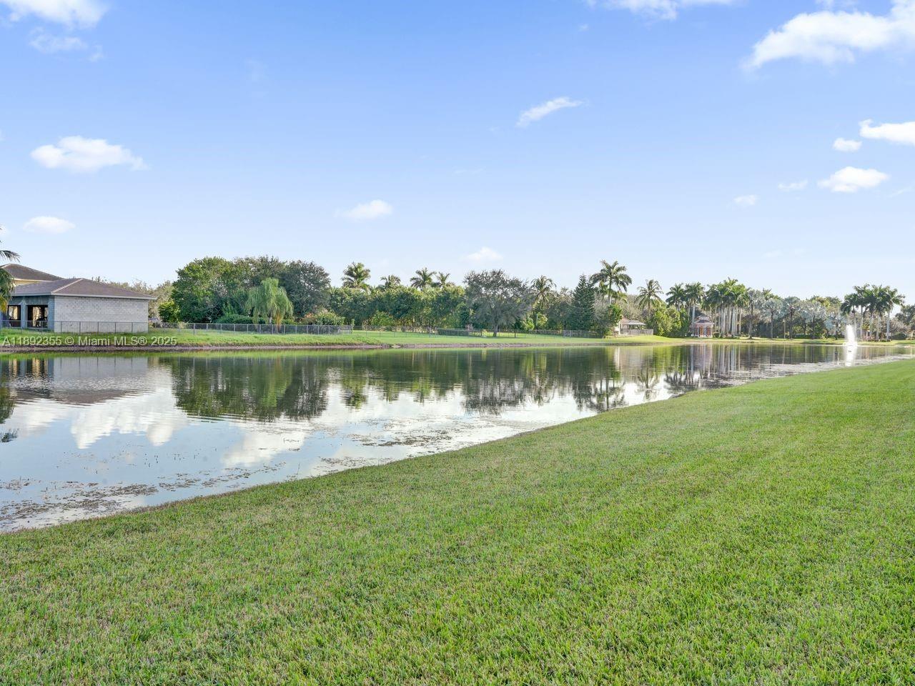 14403 Jockey Circle Davie, FL 33330 - Photo 50 of 53 a view of a lake with houses in the back