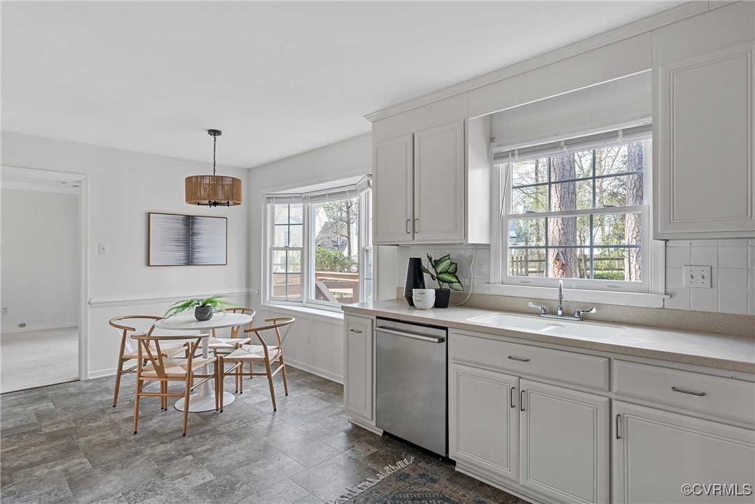 5801 Mill Spring Road Midlothian, VA 23112 - Photo 20 of 49 a kitchen with a sink table and chairs