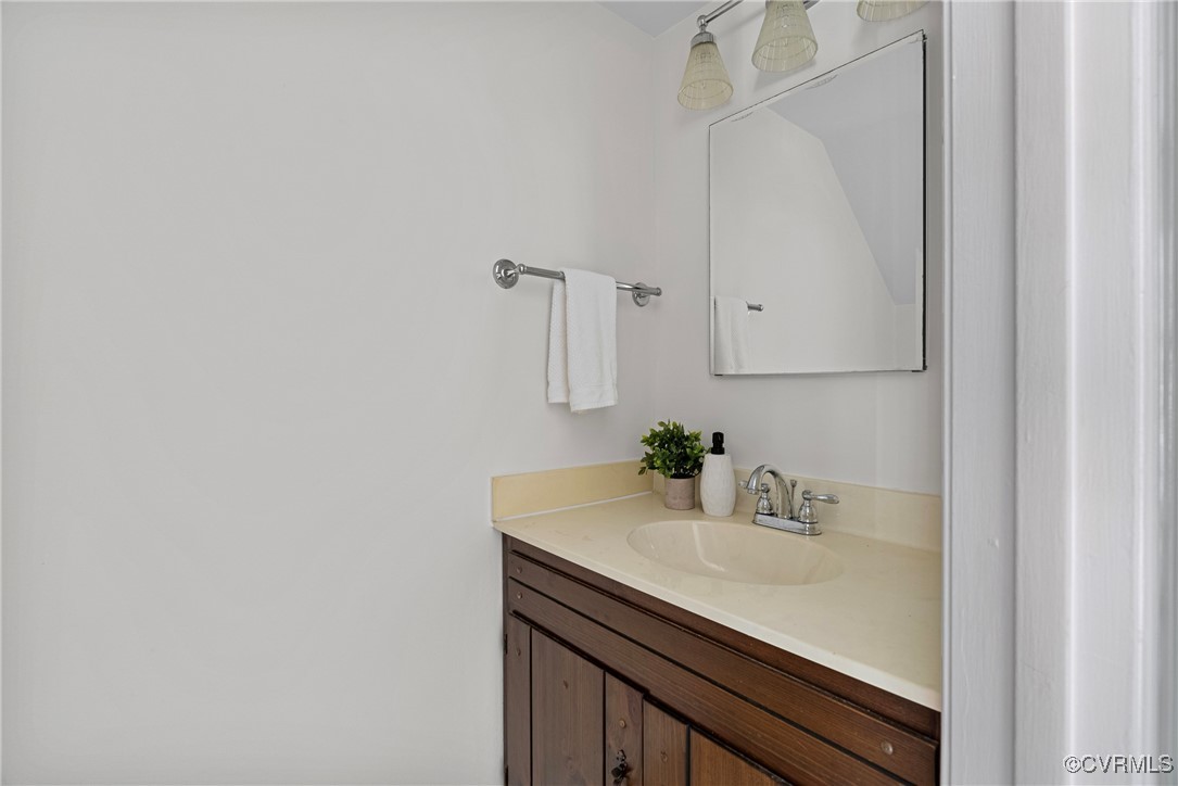 5801 Mill Spring Road Midlothian, VA 23112 - Photo 27 of 49 a bathroom with a sink and a mirror