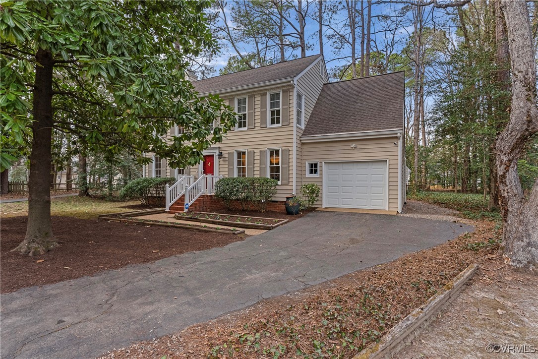 5801 Mill Spring Road Midlothian, VA 23112 - Photo 3 of 49 a view of a house with a yard and garage