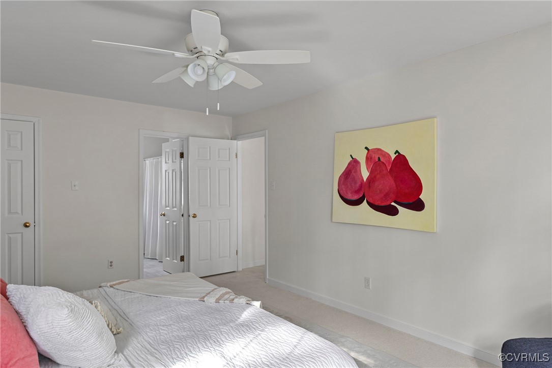 5801 Mill Spring Road Midlothian, VA 23112 - Photo 31 of 49 a bedroom with a bed and a chandelier