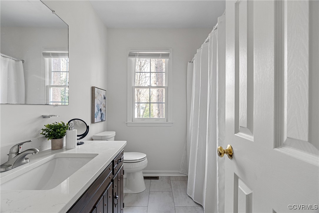 5801 Mill Spring Road Midlothian, VA 23112 - Photo 32 of 49 a bathroom with a sink and a mirror