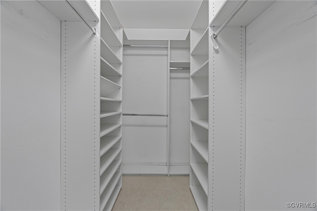 5801 Mill Spring Road Midlothian, VA 23112 - Photo 33 of 49 a view of walk in closet with empty racks