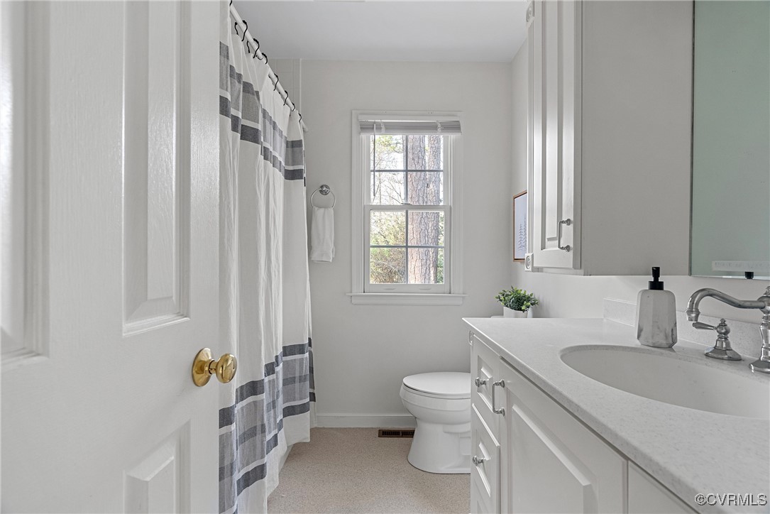 5801 Mill Spring Road Midlothian, VA 23112 - Photo 41 of 49 a bathroom with a sink toilet and tub
