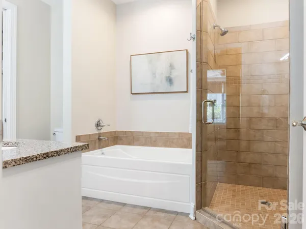 a bathroom with a bathtub and a shower