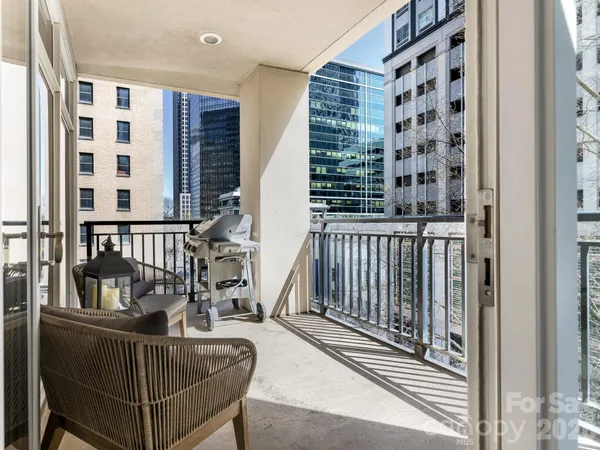 a view of a balcony with furniture