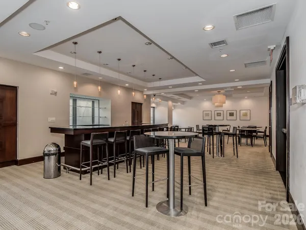 a room with lots of chairs and appliances