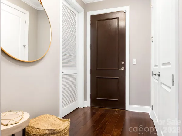 a bathroom with a toilet and a mirror