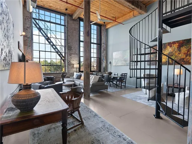 a dining room with furniture and a window