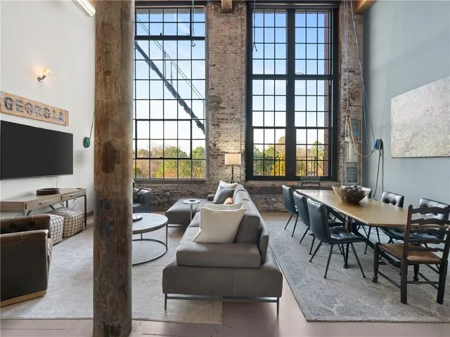 a living room with fireplace furniture and a flat screen tv
