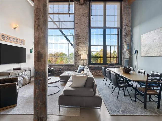 a living room with fireplace furniture and a flat screen tv