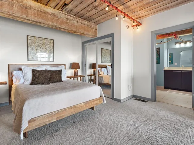 a view of a living room and kitchen with furniture