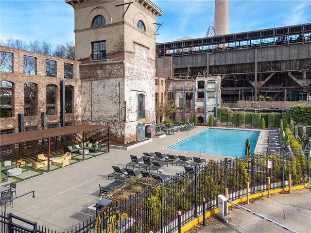 a view of a city with lawn chairs
