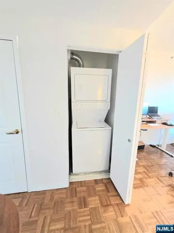 a view of utility room and closet