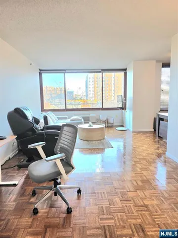 a work room with furniture and wooden floor