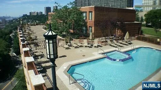 a view of a chairs and table in patio
