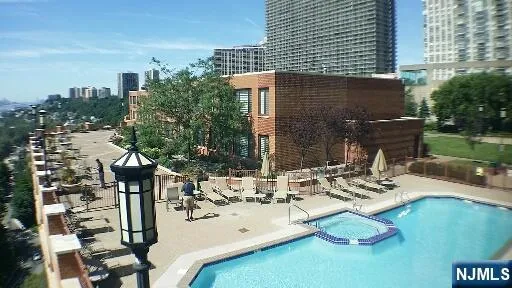 a view of a patio with table and chairs and potted plants