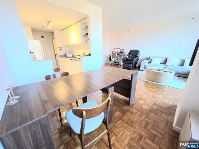 a view of a dining room with furniture and a wooden floor