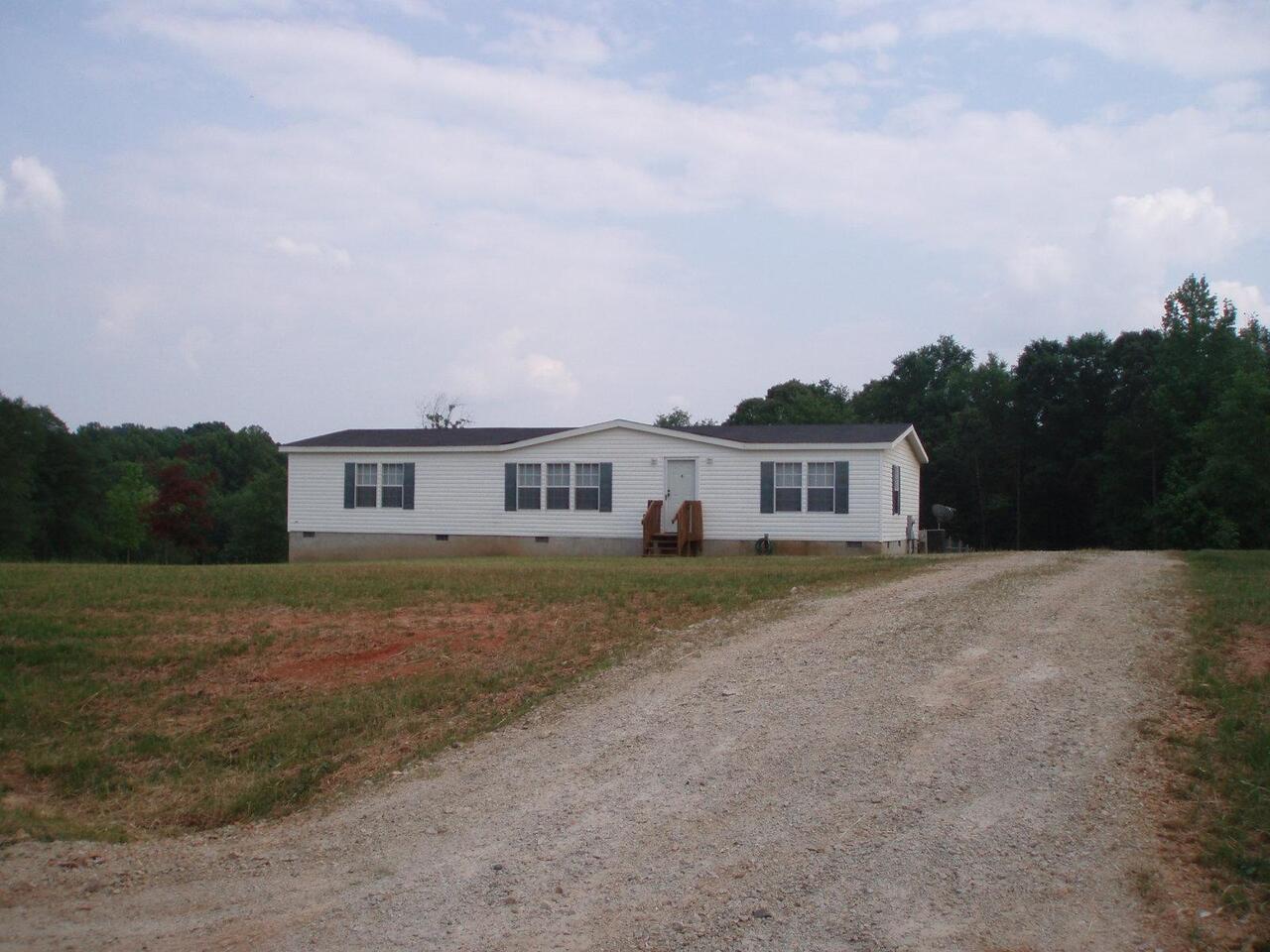 761 Crump Mill Road Martin, GA 30557 - Photo 1 of 1 a front view of a house with a yard
