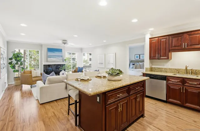 a kitchen with a stove a sink and a refrigerator