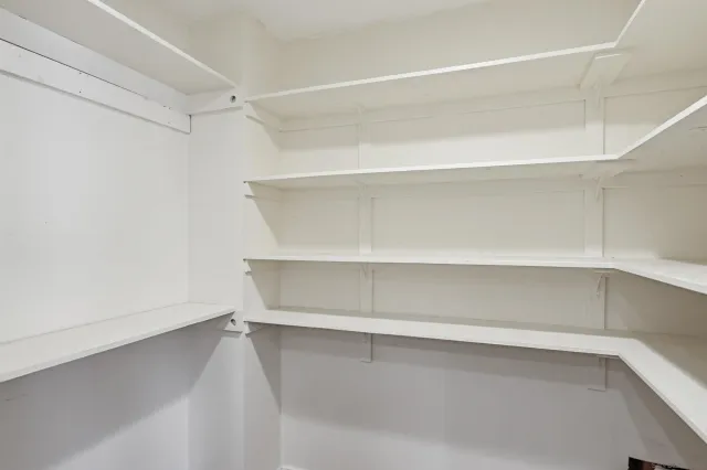 a view of an empty walk in closet