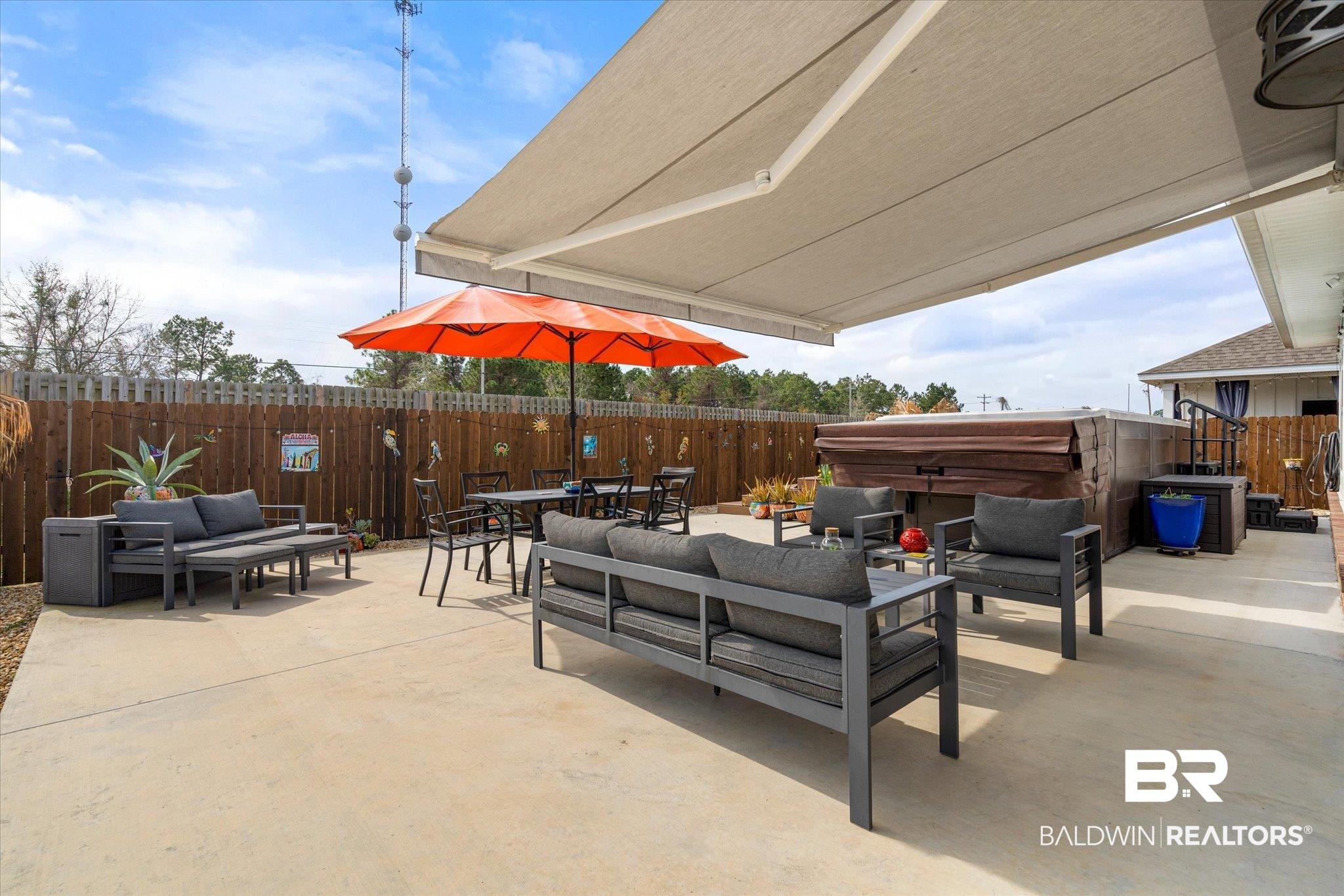 23246 Lieutenant Avenue Foley, AL 36535 - Photo 28 of 36 View of patio featuring a hot tub and an outdoor living space