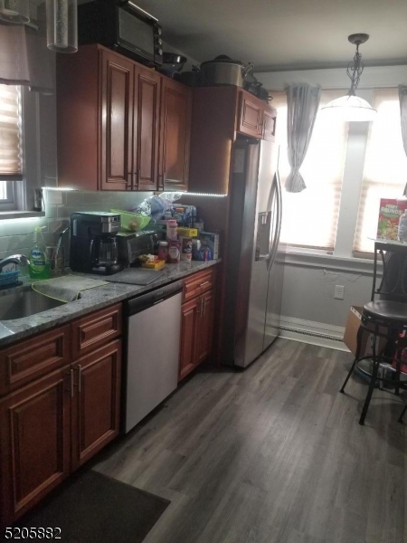 426 Cornelia Street, Unit 1 Boonton, NJ 07005 - Photo 3 of 7 a kitchen with stainless steel appliances granite countertop a refrigerator and a sink