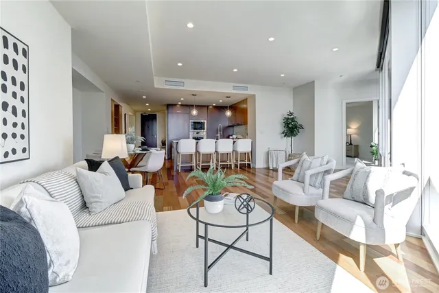 a living room with furniture and a large window