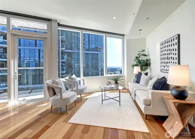 a living room with furniture and a large window