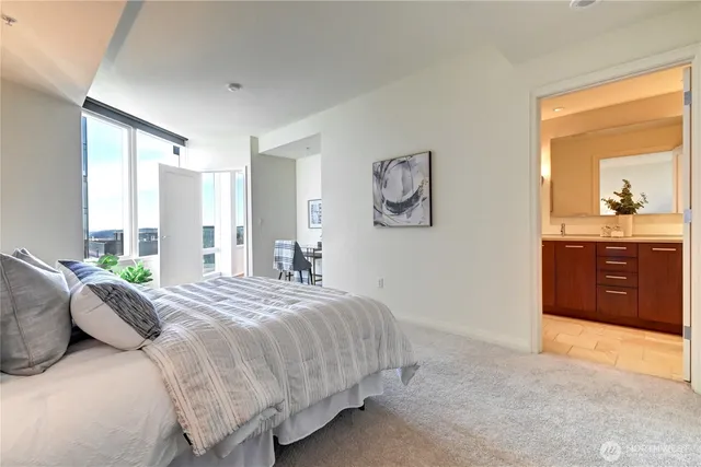 a bedroom with a bed and a cabinets