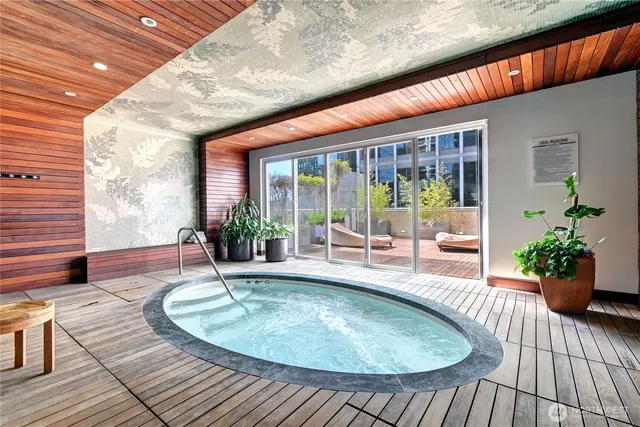 a view of a swimming pool with outdoor seating