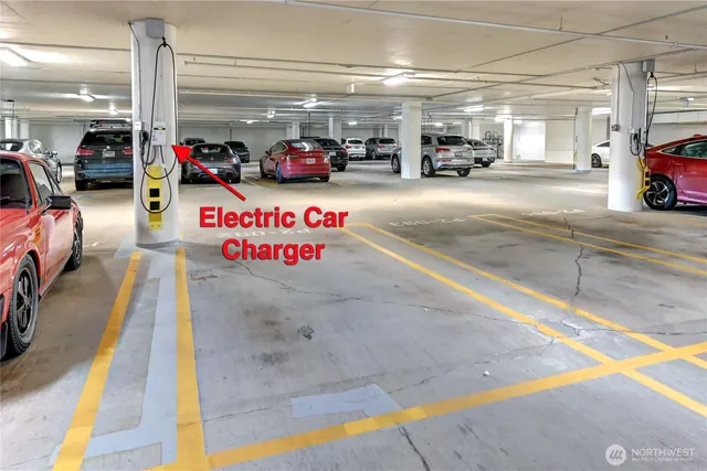 a view of parking garage with cars