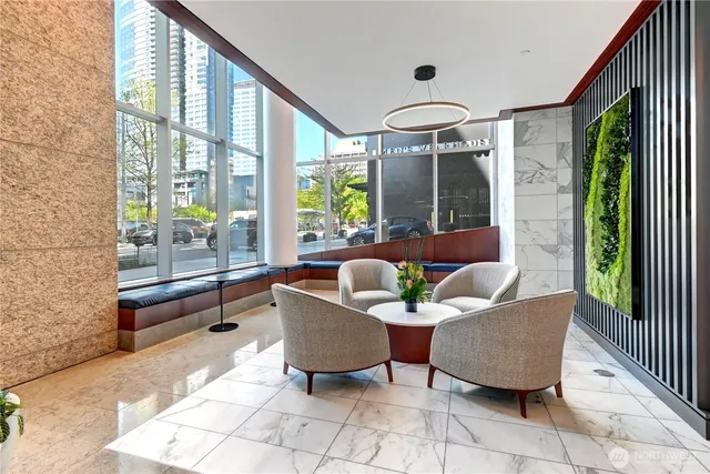 a living room with furniture and a large window