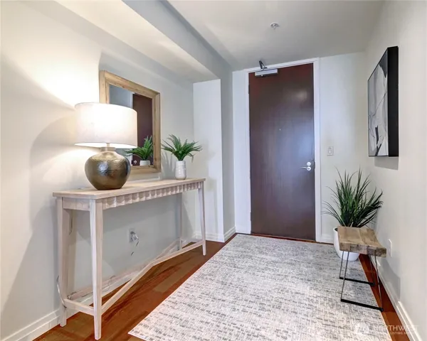 a bedroom with a bed and a potted plant