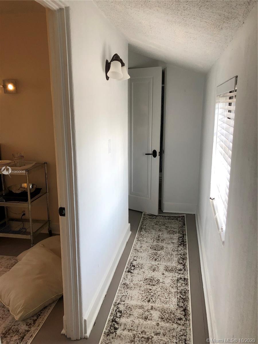 4770 Alton Road Miami Beach, FL 33140 - Photo 22 of 24 Separate entrance guest quarters hallway to bedroom and bathroom