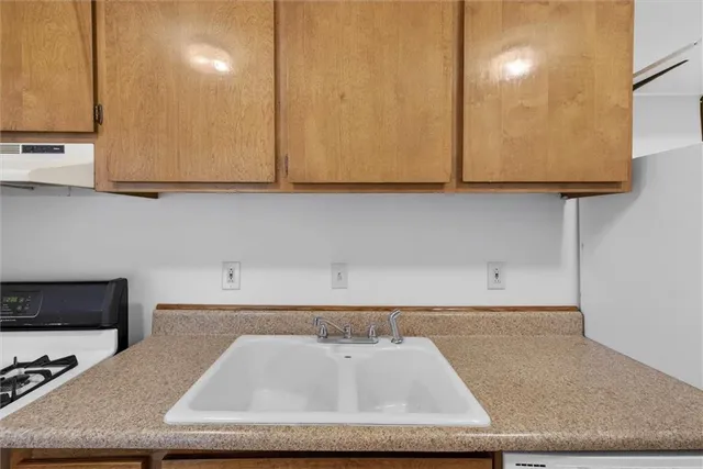 a bathroom with a sink a mirror and a toilet