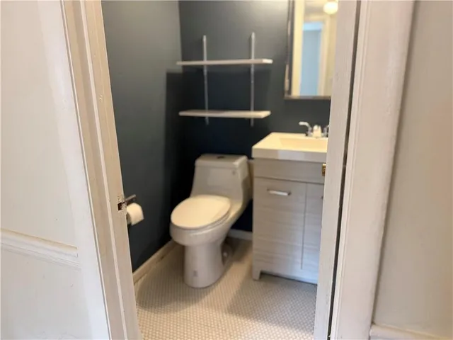 a bathroom with a toilet and a sink