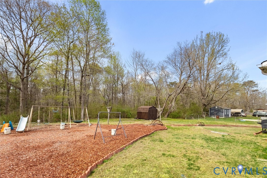 6436 Macedonia Road Woodford, VA 22580 - Photo 12 of 12 View of grassy yard with a storage shed