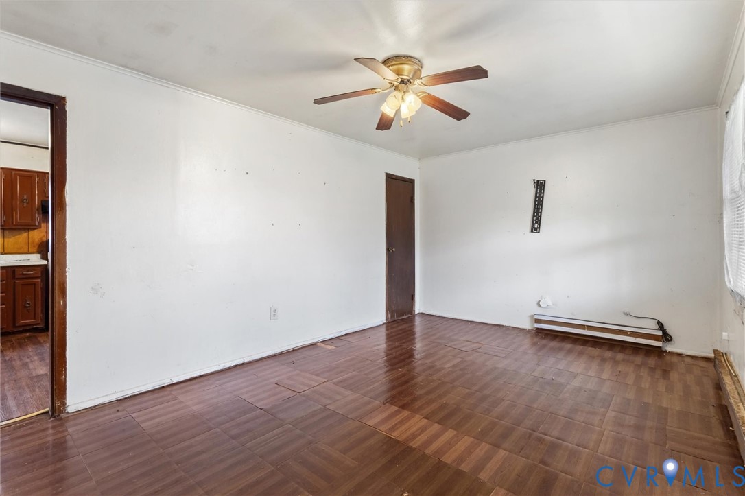 6436 Macedonia Road Woodford, VA 22580 - Photo 5 of 12 Empty room with a ceiling fan, baseboard heating,