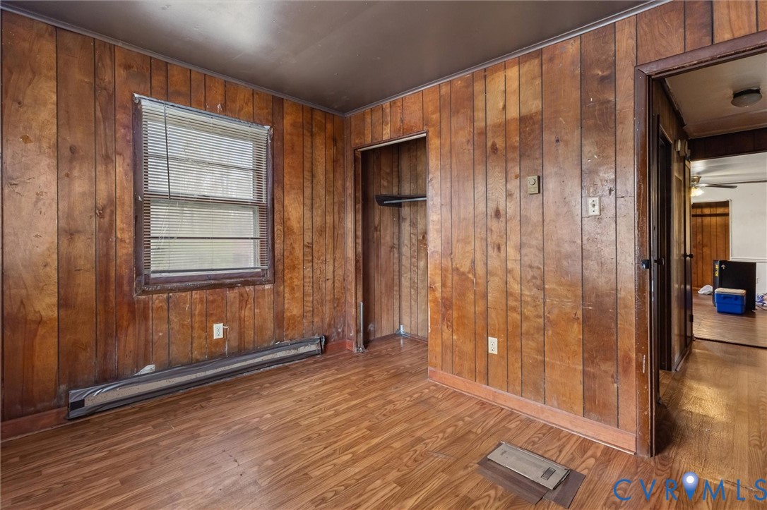 6436 Macedonia Road Woodford, VA 22580 - Photo 9 of 12 Spare room featuring a baseboard heating unit, dar