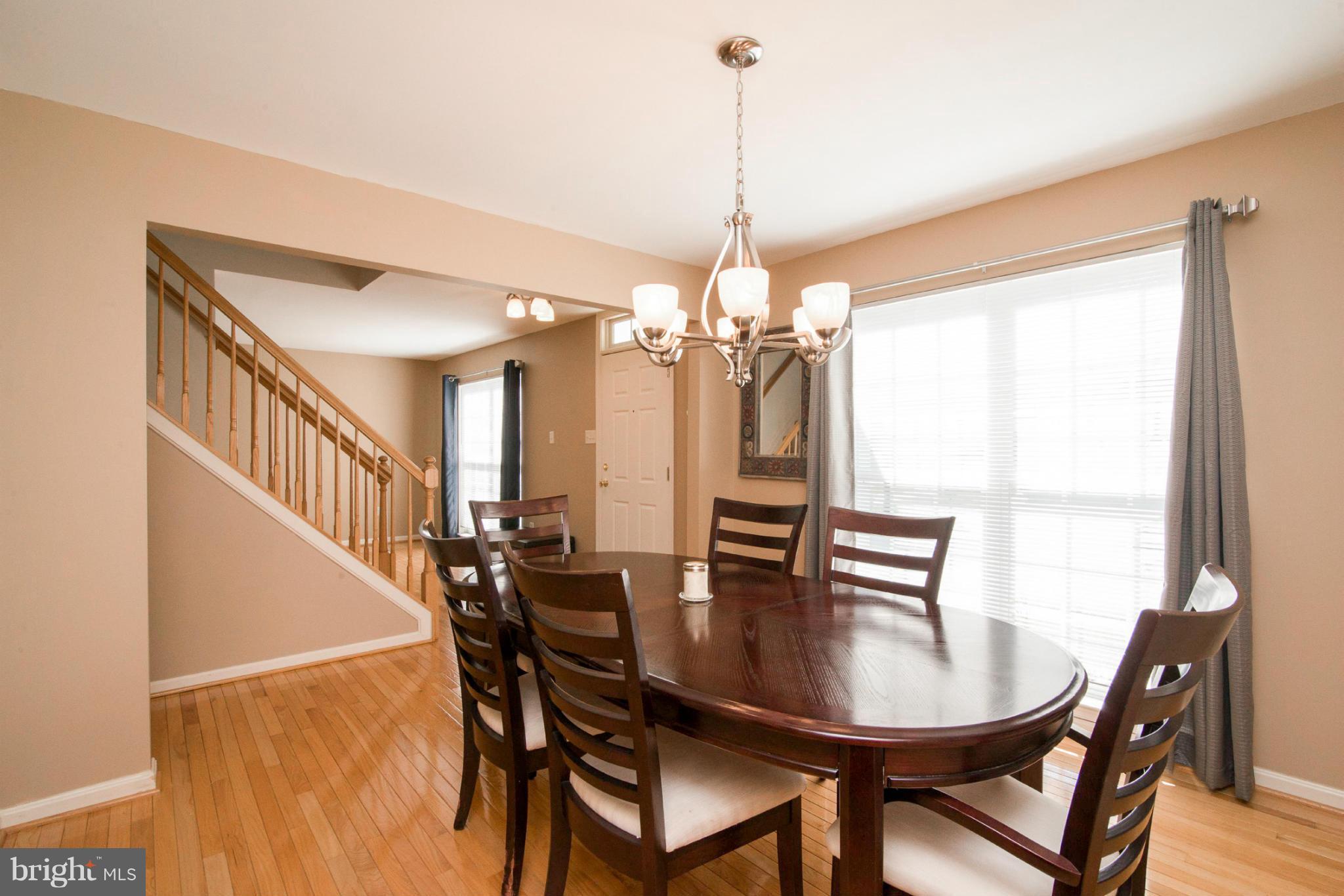 3044 Shoreline Boulevard Laurel, MD 20724 - Photo 5 of 13 a view of a dining room with furniture window and wooden floor
